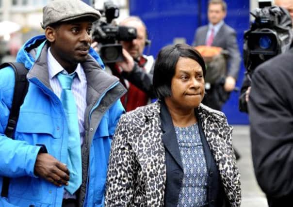 Doreen Lawrence arrives with her son Stuart to meet Metlice chief Sir Bernard Hogan-Howe. Picture: PA PO