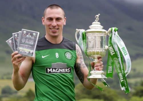 Scott Brown promotes the club's new DVD, charting Celtic's 125-year history. Picture: SNS