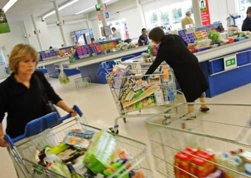 Shoppers at a branch of supermarket giant Tesco. Picture: PA