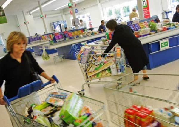Shoppers at a branch of supermarket giant Tesco. Picture: PA