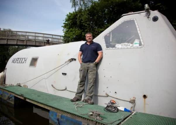 Jeff Doyle with his boat 'Murdoch', in Bath Marina. Picture: HeMedia