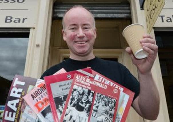 Neil Connolly is selling hundreds of old Hearts match day programmes. Picture: Neil Hanna