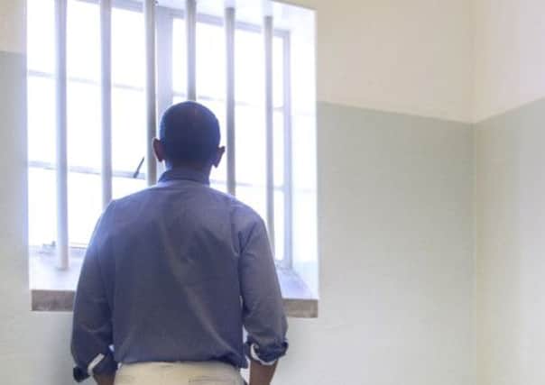 Barack Obama in Nelson Mandelas cell at Robben Island. Picture: AFP/Getty