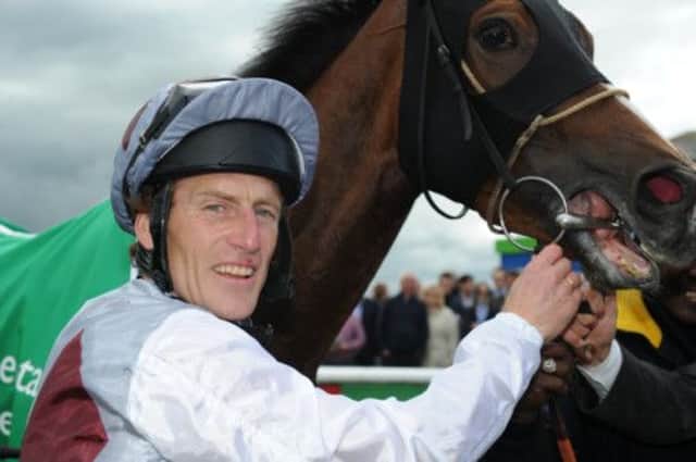 Johnny Murtagh is all smiles after winning on Ambivalent at Curragh. Picture: PA