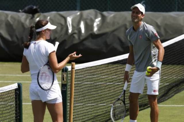 Laura Robson takes a break from practice at Aorangi Park yesterday to enjoy a chat with Novak Djokovic. Picture: Reuters