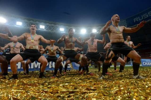 New Zealands players dance and sing in Moscow as they celebrate an emphatic victory. Picture: AFP/Getty