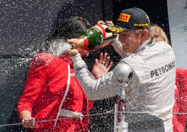 Mercedes driver Nico Rosberg celebrates his second Formula One victory of the year. Picture: Ian Georgeson