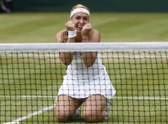 Sabine Lisicki drops to her knees in delight after securing a place in todays quarter-finals. Picture: Reuters