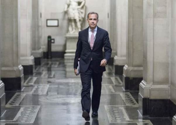 Mark Carney strides out to a monetary policy committee briefing on his first day inside the central banks headquarters. Picture: Getty