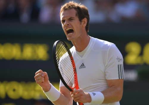 Andy Murray celebrates winning a set over Mikhail Youzhny. Picture: AFP