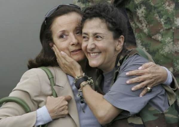 On this day in 2008 Ingrid Betancourt, right, and 14 other hostages held by Farc guerillas were rescued in Columbia. Picture: AP