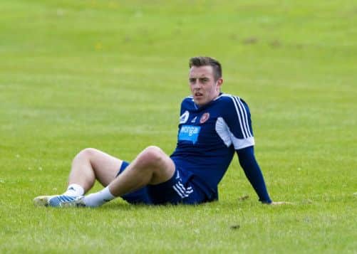 Jason Holt is pleased Danny Wilson (pictured) agreed to stay at Hearts. Picture: SNS