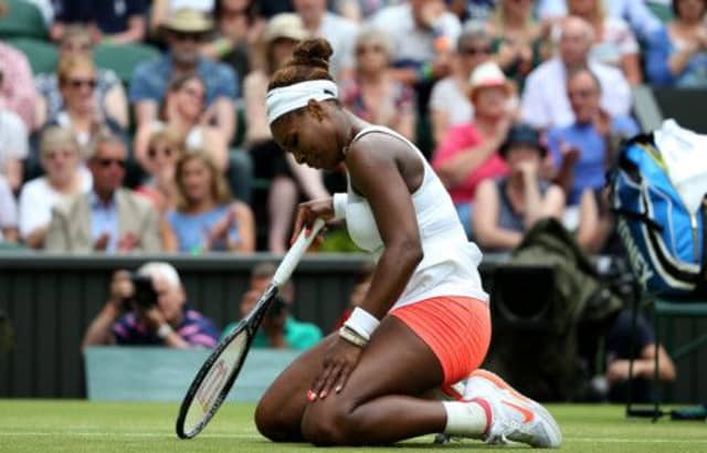 Serena Williams ends up on the ground during her match against Germany's Sabine Lisicki. Picture: PA