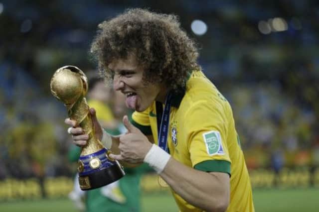 David Luiz celebrates Brazils deserved 3-0 win over Spain in Sundays final in Rio de Janiero. Picture: AP