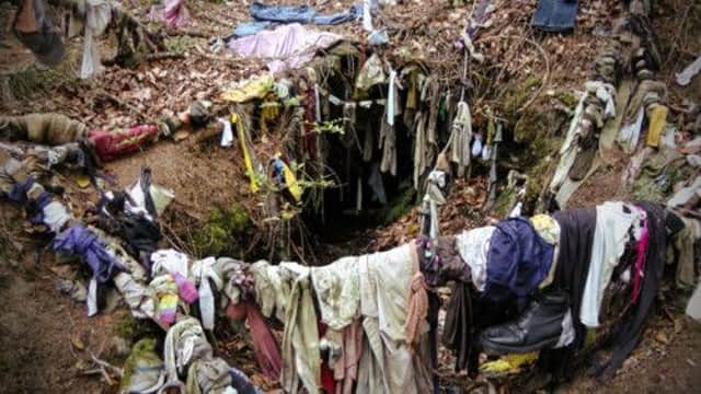 A clootie well where shoes, pants, socks and rags can be seen