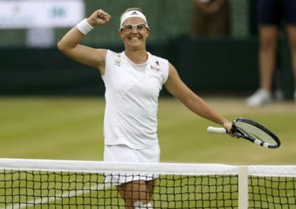 Kirsten Flipkens celebrates after defeating Petra Kvitova. Picture: Reuters