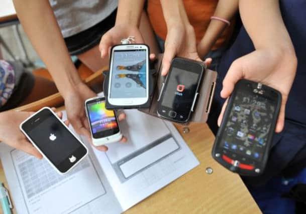 Researchers are setting out to discover how a growing obsession with smartphones is affecting working and social lives. Picture: Getty