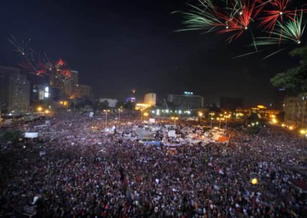 Opponents of Mohammed Morsi celebrate in Cairo's Tahrir Square as reports suggest Morsi has been removed from office. Picture: AP