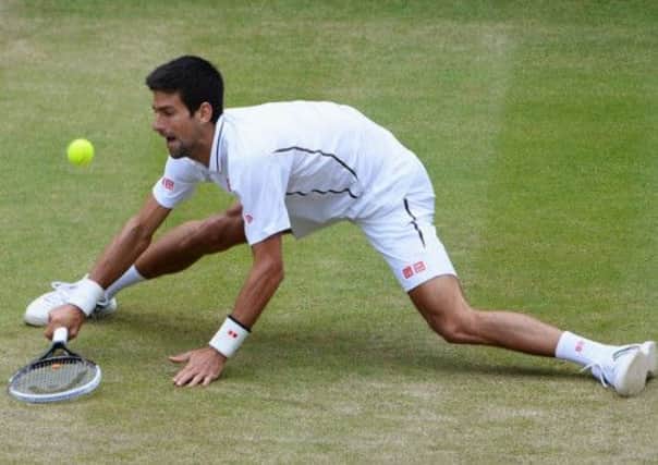 Novak Djokovic at full stretch. The Serbian reached the semi-finals with a win over Thomas Berdych. Picture: Getty
