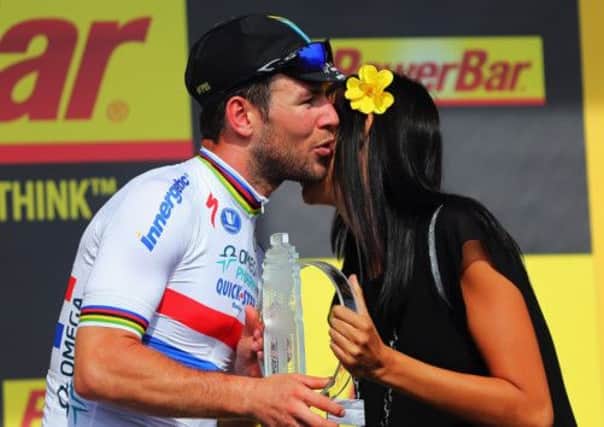 Mark Cavendish receives his trophy after his stage five win. Picture: Getty