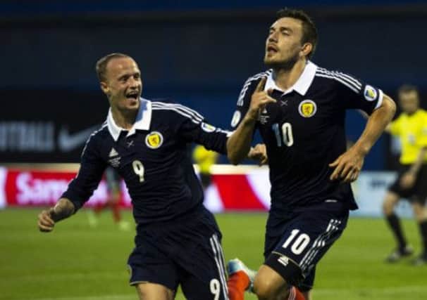Robert Snodgrass celebrates with Leigh Griffiths after scoring the winner against Croatia. Picture: SNS