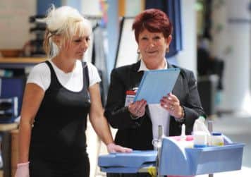 The new iPad app sends information direct from office cleaners to the client. Picture: Jane Barlow