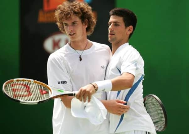 Friends and rivals: Murray and Djokovic celebrate winning a point during a doubles match at the 2006 Australian Open. Picture: Getty