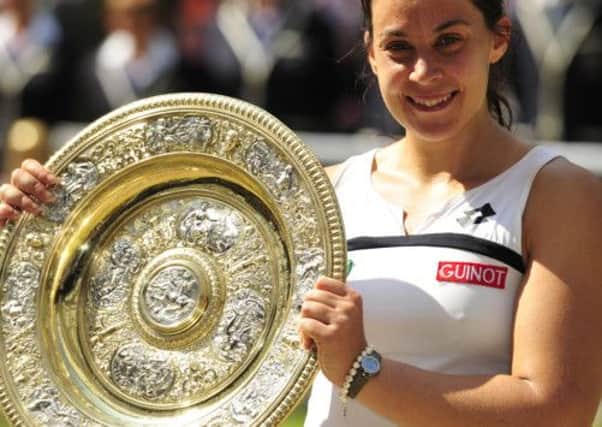 Marion Bartoli shows off her Wimbledon women's title. Picture: Getty