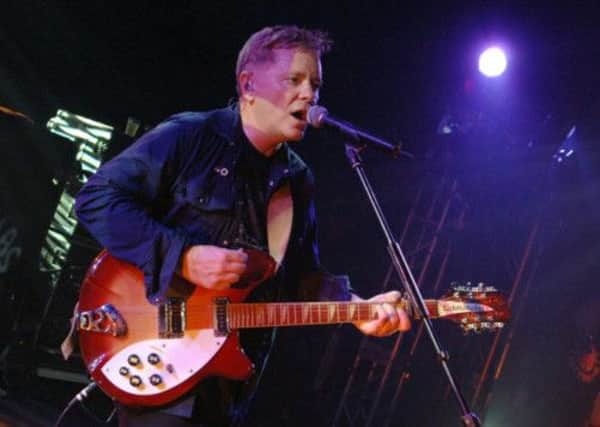 New Order perform on stage. Picture: PA