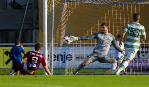 Pantelis Kapetanos fires the ball past Celtic keeper Fraser Forster to score the second goal of the game. Picture: SNS