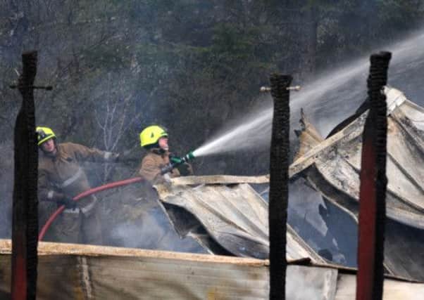 Firefighters tackle the blaze at the Falls of Shin Visitor Centre