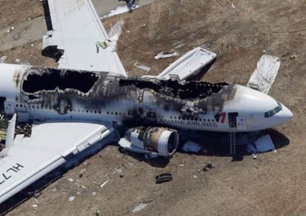 The Asiana Airlines Boeing 777 lies burned after it crash-landed at San Francisco International Airport. Picture: Getty