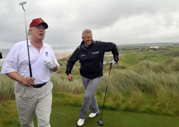 American tycoon Donald Trump with golfer Colin Montgomerie at the Menie Estate course, which opened last year. Picture: Phil Wilkinson