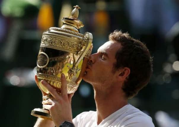 Andy Murray celebrates with the Wimbledon trophy. Picture: Getty
