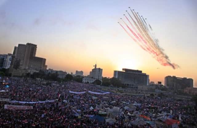 The Egyptian Air Force fly over Tahrir Square, Cairo. Picture: AP