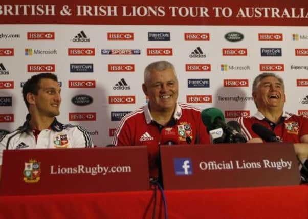 Gatland, centre, shares a joke in his final press conference before the victorious British and Irish Lions jet home. Picture: Reuters