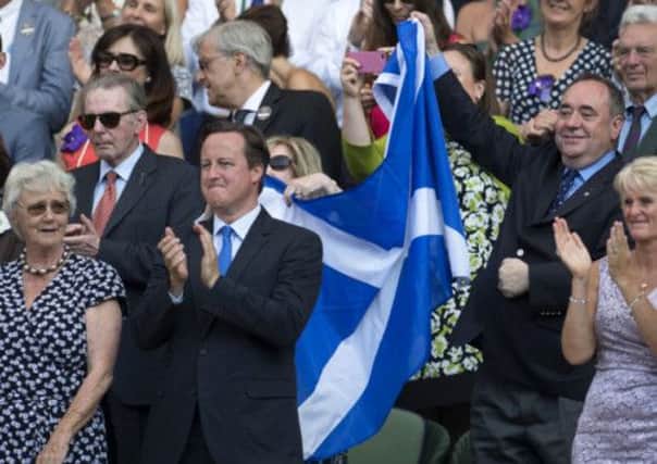 First Minister Alex Salmond with a Saltire after Andy Murray's victory in the Wimbledon final. Picture: SNS
