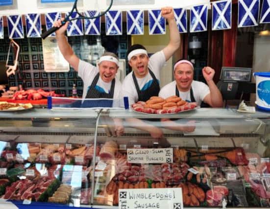 08/07/2013,  TSPL, Scotsman, Dunblane Murray mania. The town of Dunblane the day after Andy Murray's historic victory at Wimbledon.  L to R, Alec McIntosh, Stewart McClymont and Stuart Gavin  in Bennetts Butchers in Dunblane High street. Pic Ian Rutherford