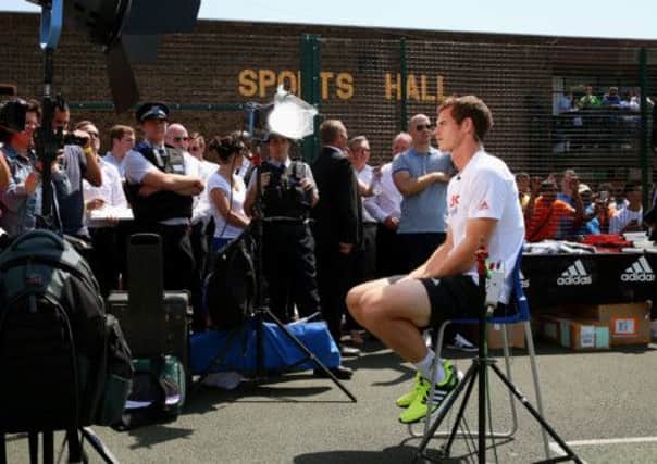 Andy Murray gives one of dozens of interviews yesterday at the Black Prince Community Hub in Kennington. Picture: Getty