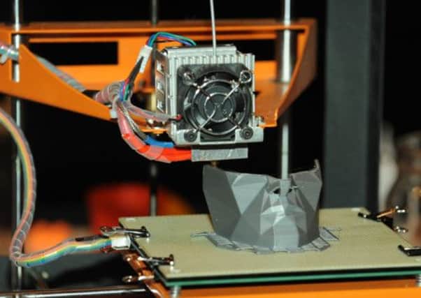A 3D printer in action last year. Maplin have unveiled the first mass-market printer at a cost of £700. Picture: PA