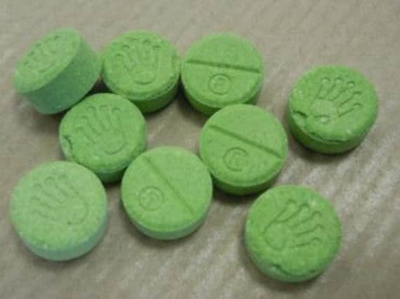 Green pills bearing a Rolex logo are being sold as ecstasy, but police have warned that they could contain deadly chemicals. Picture: PA