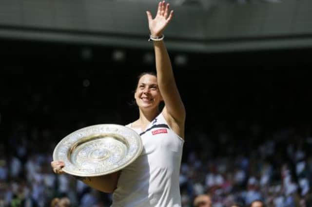 France's Marion Bartoli has her moment in the sun. Picture: Getty