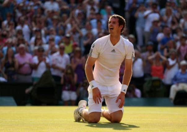 Andy Murray sinks to his knees, effort etched on his face, after winning the draining, decisive final game of the third set. Picture: Getty