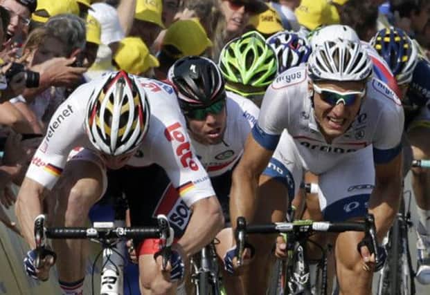 Mark Cavendish in between Andre Greipel and Marcel Kittel shortly before the crash. Picture: Reuters