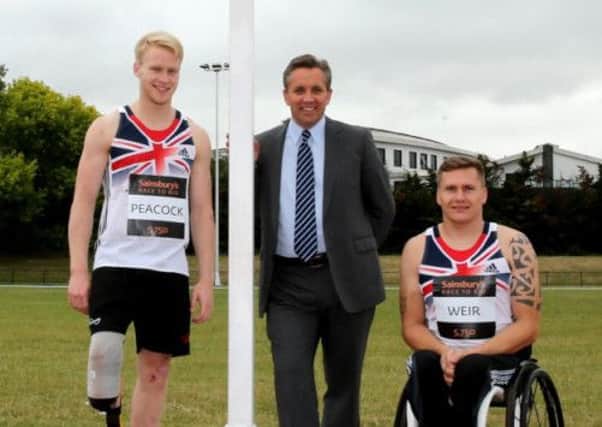 Sainsbury's Chief Executive Justin King alongside Paralympic gold medallists Jonnie Peacock (L) and David Weir. Picture: PA