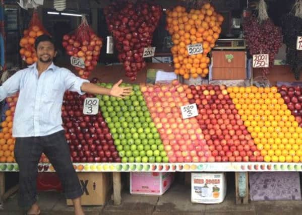 Businesses like this Sri Lankan fruit stand could benefit from volunteer assistance. Picture: Contributed