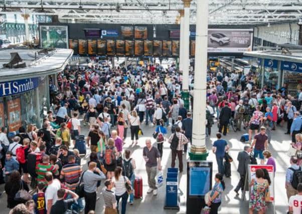 Rail passengers at Edinburgh's Waverely Station. Alcohol-related crimes have doubled since ScotRail's introduction of a booze ban. Picture: Ian Georgeson