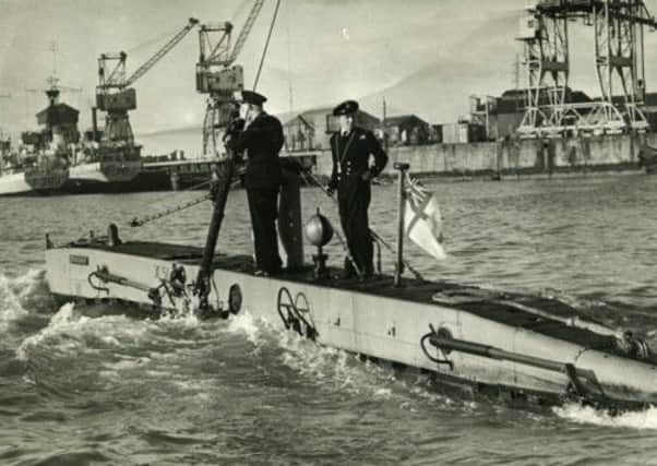 Two Navy servicemen on a 'Stickleback' submarine in 1954. Picture: Royal Maritime Museum