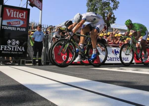 Marcel Kittel of Germany edges home ahead of Mark Cavendish and green jersey holder Peter Sagan. Picture: AP