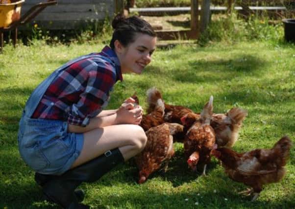 Lizzie with the rescued hens. Picture: Contributed